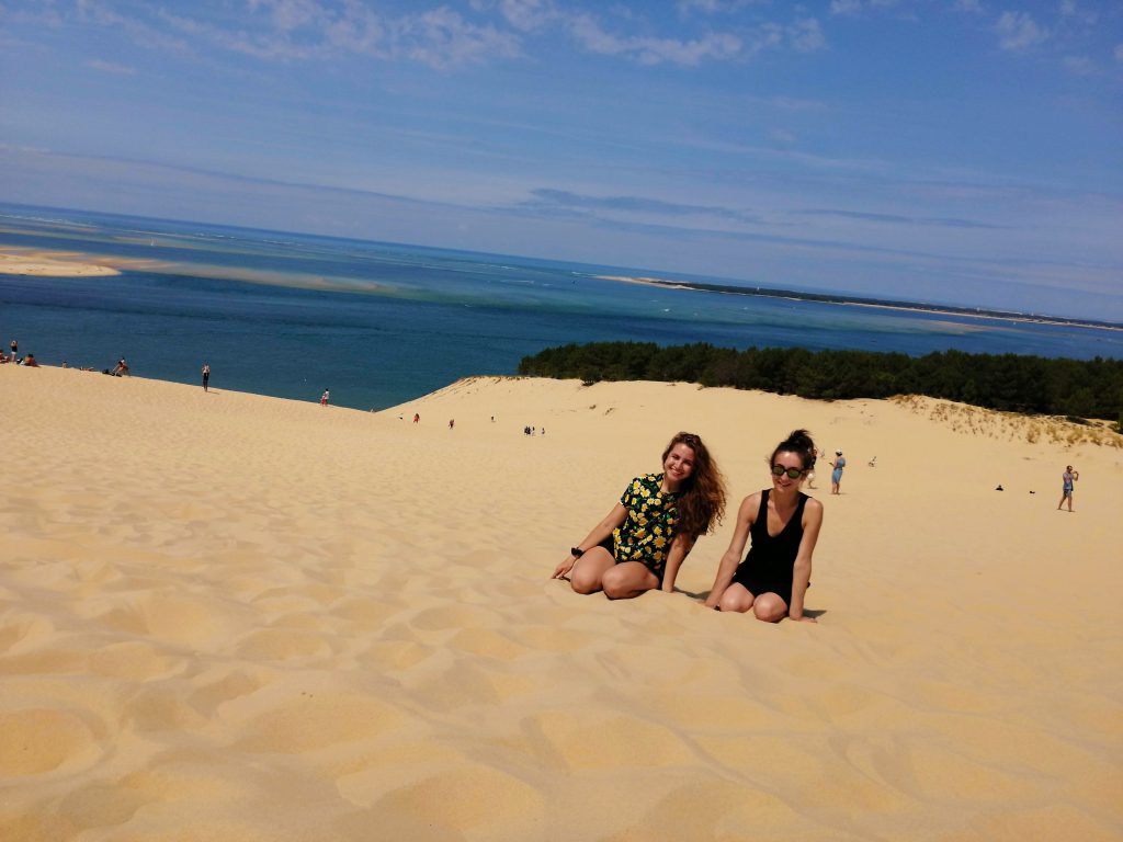 Xiomara Matathias and another student pose for a picture at the beach.