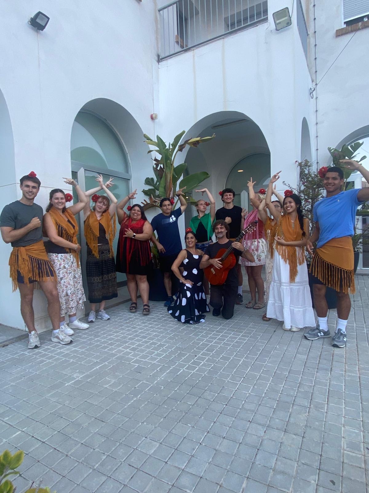 UMass Lowell study abroad students pose with Flamenco dancers in summer 2025.