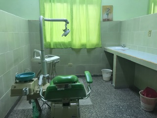 One of three chairs in the dentist area of the clinic. 