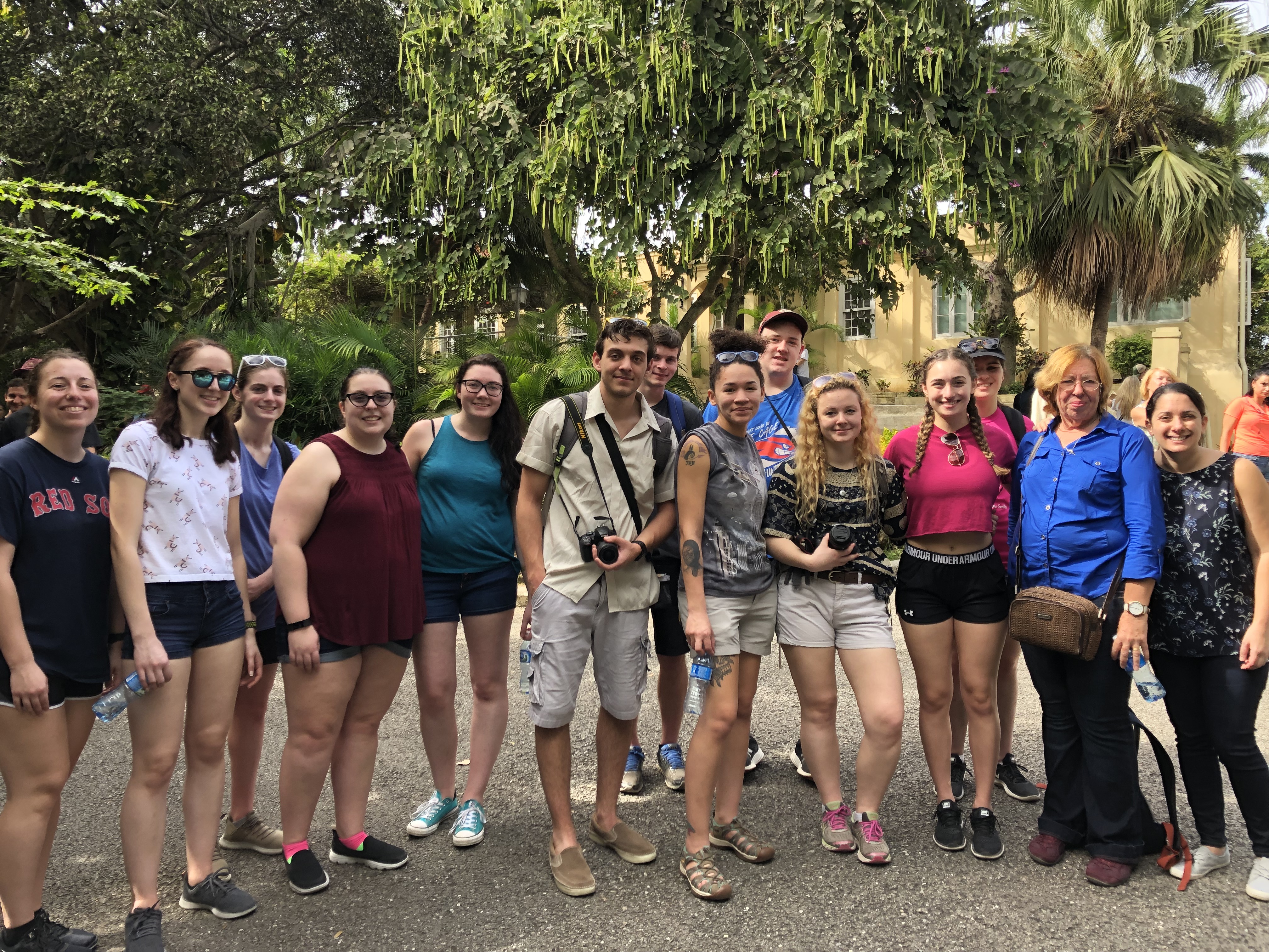 Honors students stand before Finca Vigia, the Cuban home of American writer Ernest Hemingway.