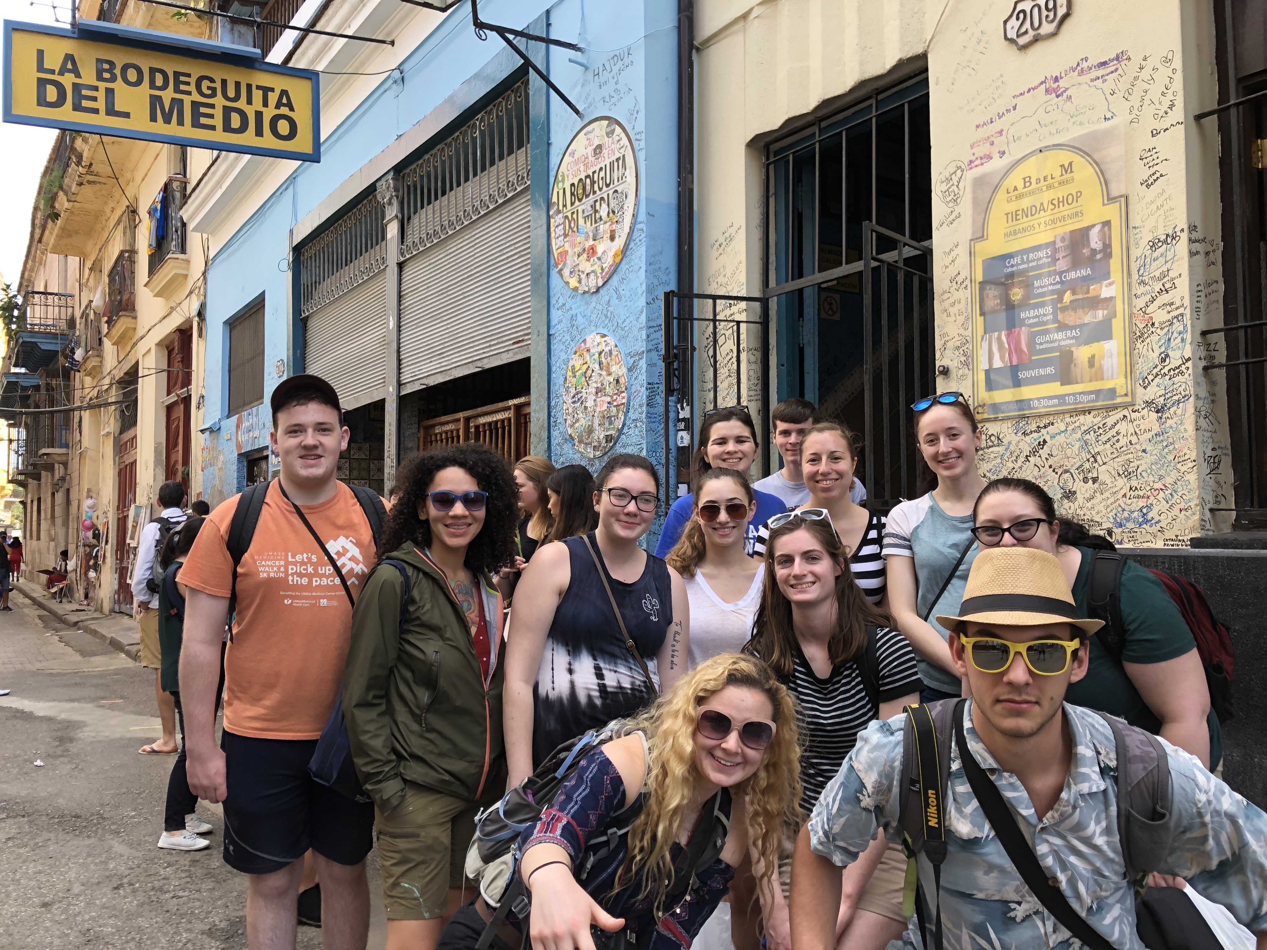 Students pose before La Bodegita del Medio, a bar in Old Havana popular for their mojitos.