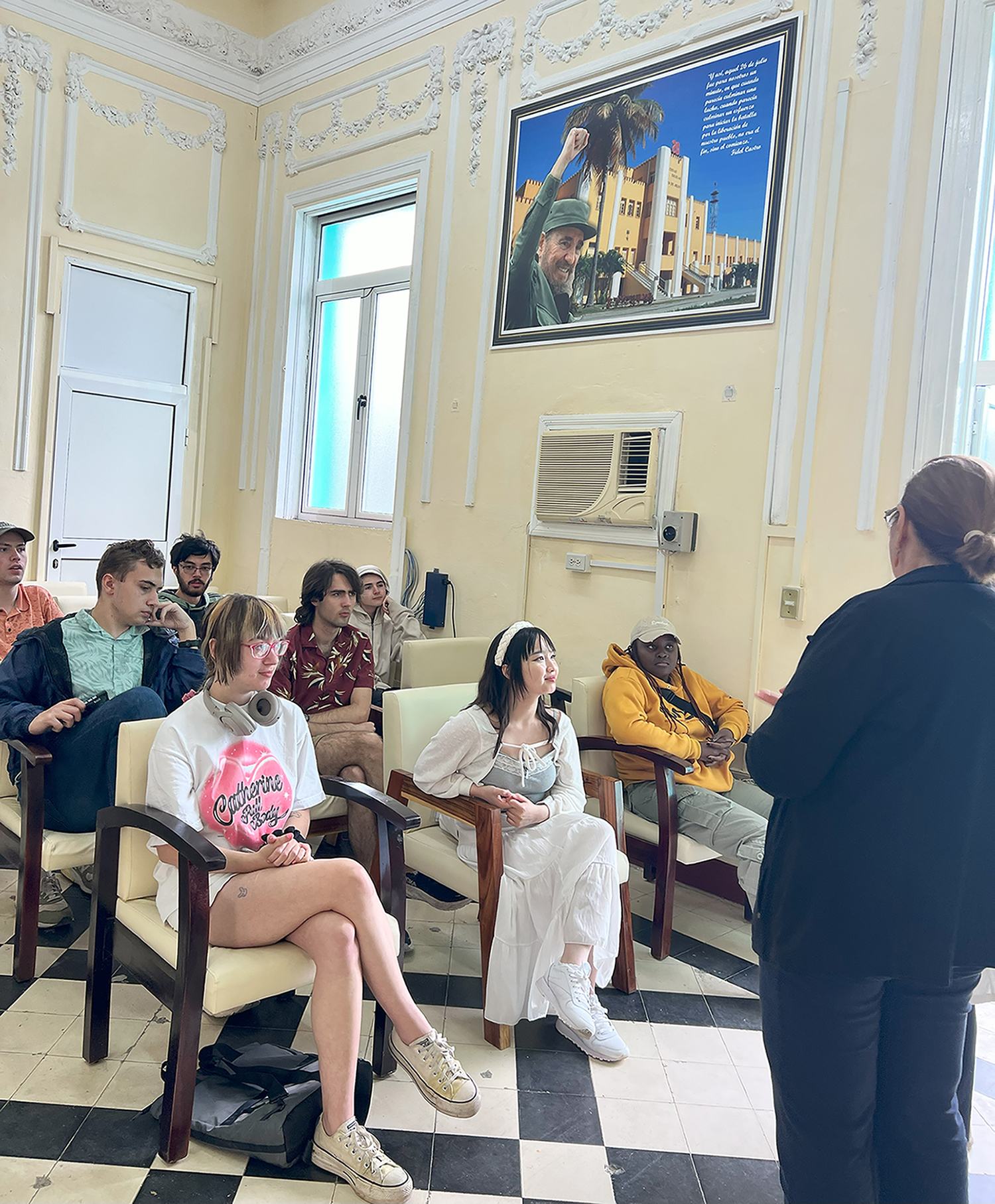 Students listen to a presentation at a Cuban health care system.