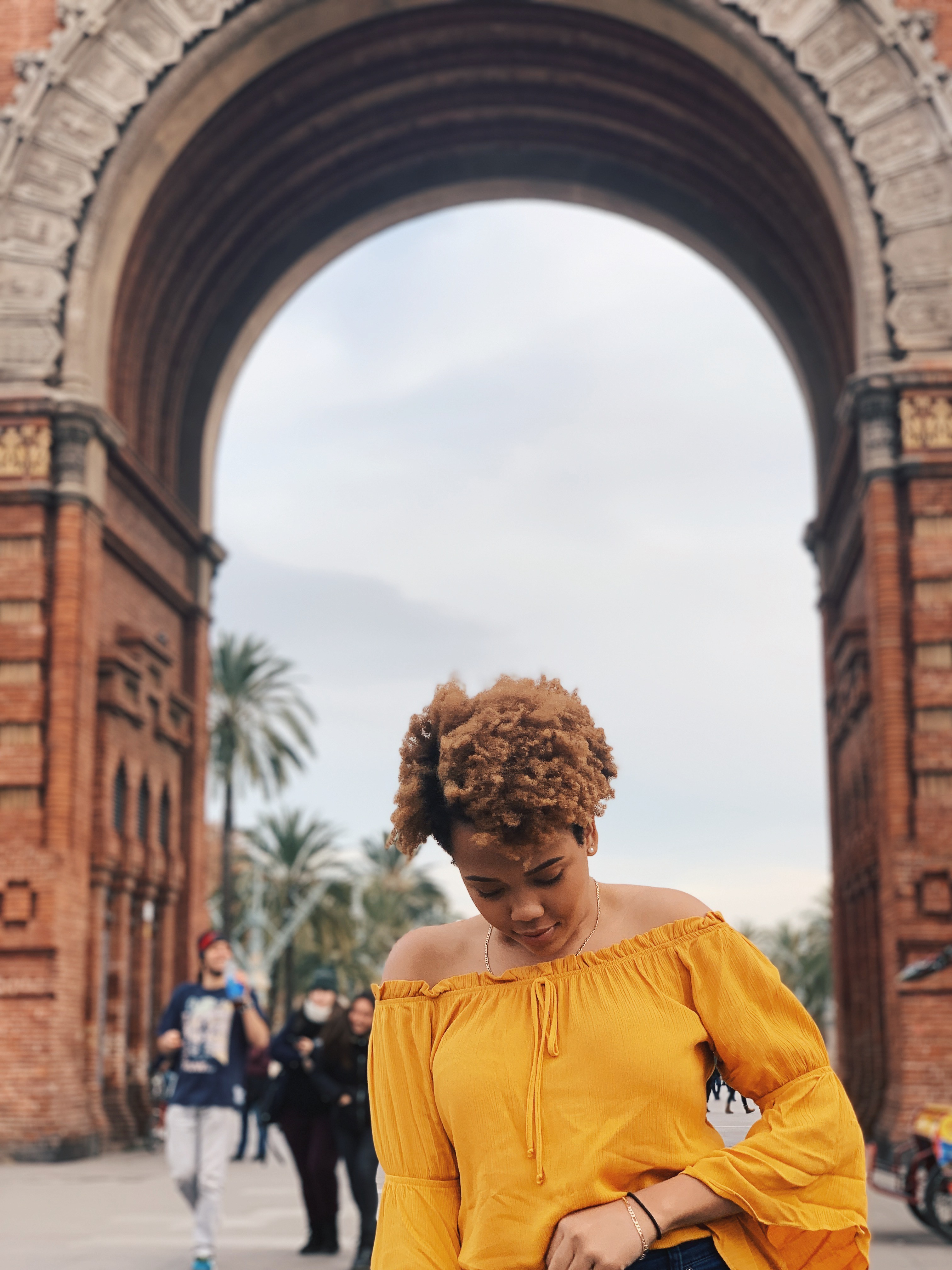 Luzmia Ligonde poses in front of La Sagrada Familia attraction