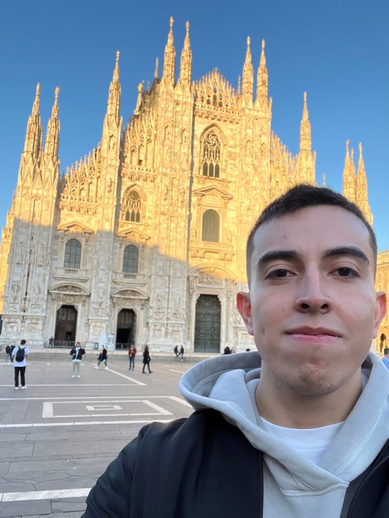 Student  Julian Vivescas stands in front of a cathedral church in Modena, Italy