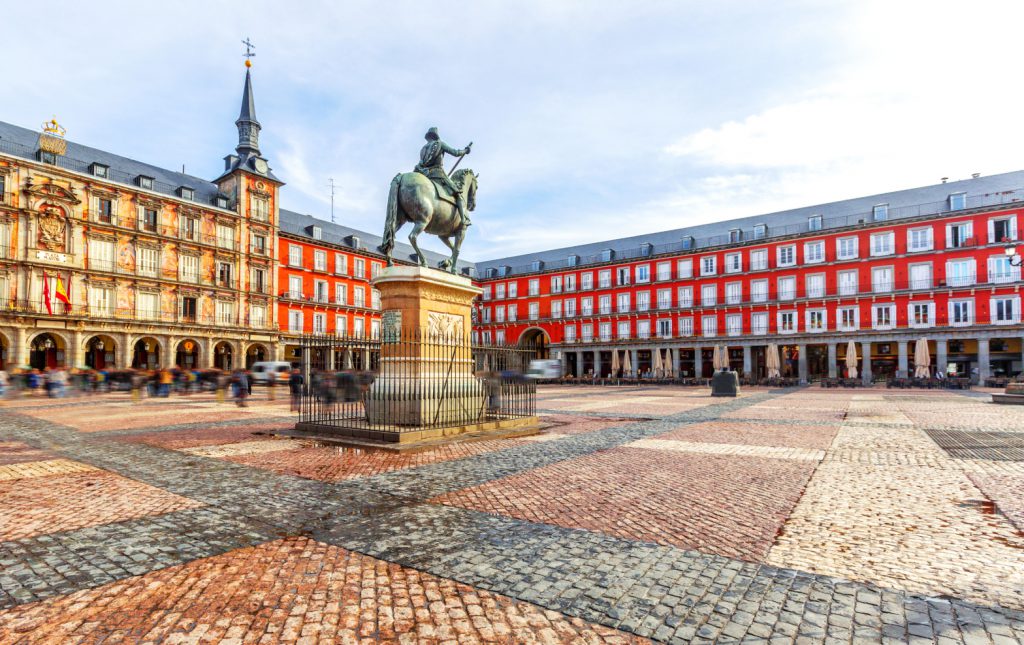 A street-level photo of Madrid's Plaza Mayor.